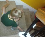 Alex starts the Slinky from the top of the stairs