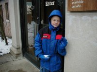 Michael hiding from Sean with a snowball ready